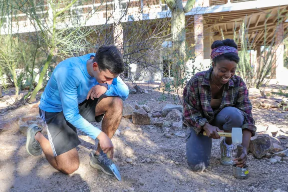 Phoenix Spivey leading soil sampling at Old Main as part of her Water Resources Research Center Student Research Grant